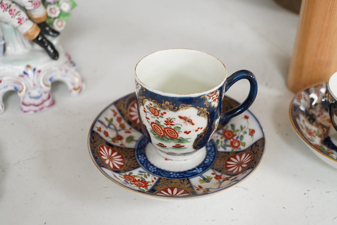 A Worcester Queen Charlotte pattern plate, Worcester scale blue coffee cup and teabowl, two French porcelain scale blue saucers, a fruit painted oval dish and a model of a boy emblematic of winter-19cm high